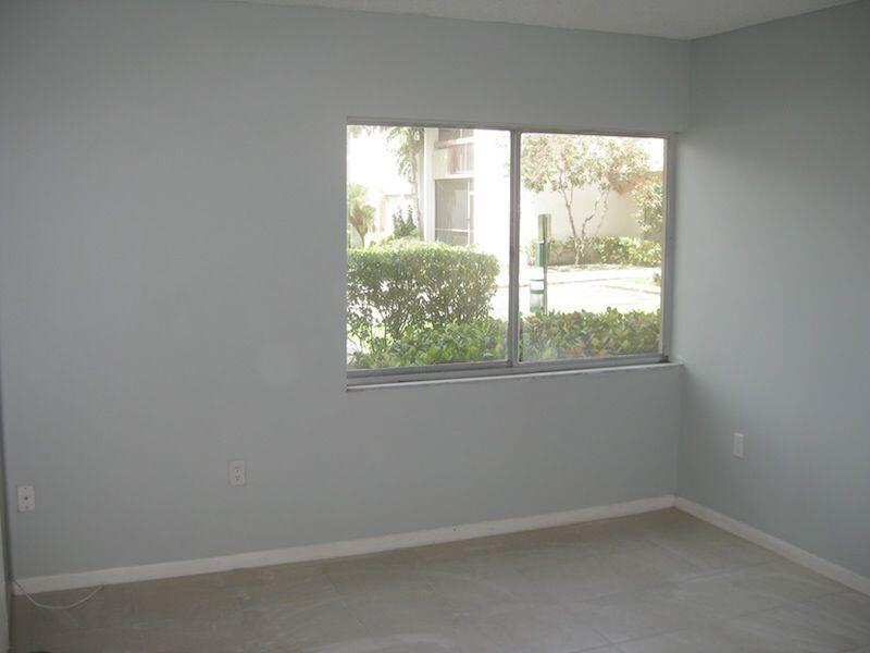 721 North Pine Island Road, Unit 116 Plantation, FL 33324 - Photo 9 of 23 an empty room with a window