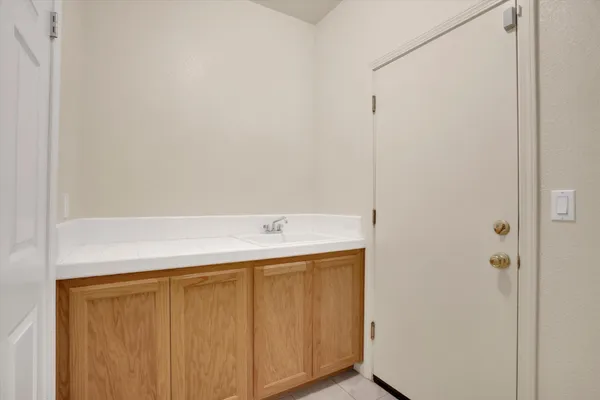 a bathroom with a sink and mirror