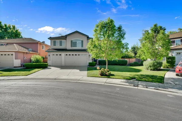 a house view with a garden space