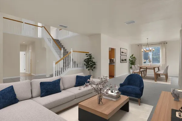 a living room with furniture or couch and a potted plant