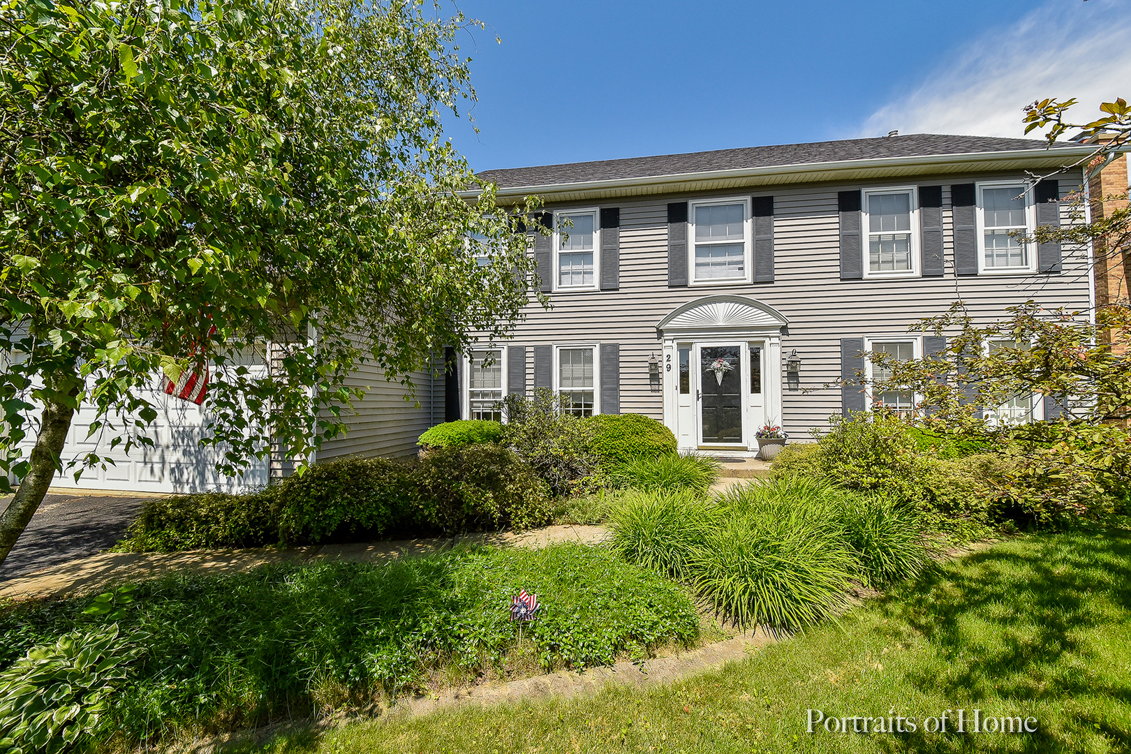 29 Christina Circle Wheaton, IL 60189 - Photo 20 of 28 a front view of a house with garden
