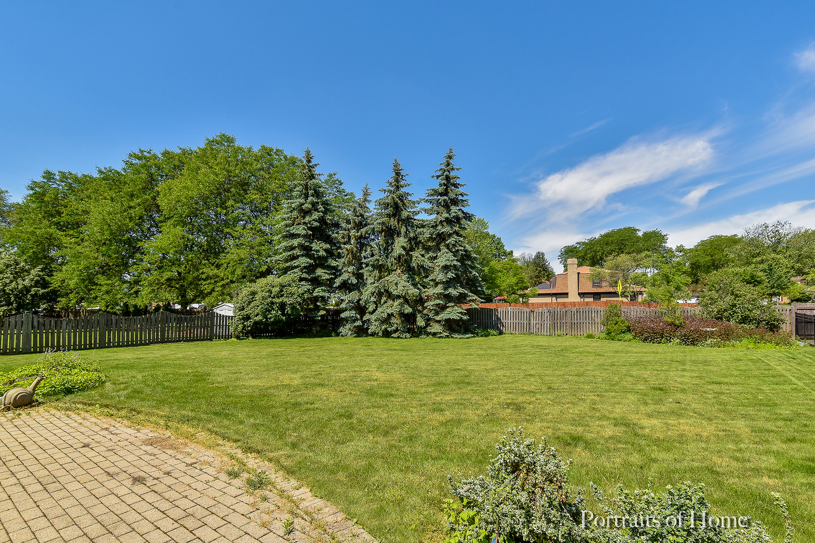 29 Christina Circle Wheaton, IL 60189 - Photo 21 of 28 a view of a garden with a building in the background