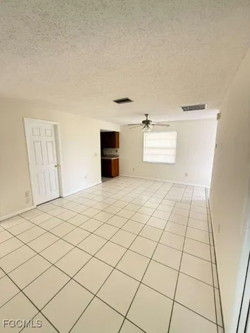 a view of an empty room and window