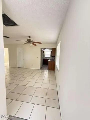 a view of a livingroom with wooden cabinets