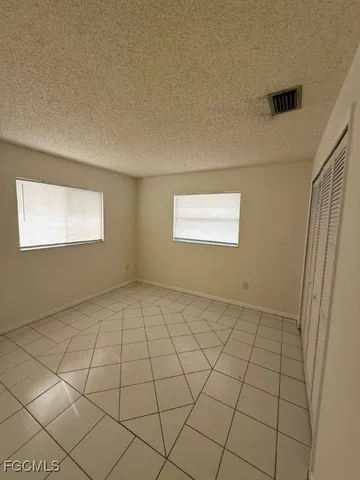 a view of an empty room and window