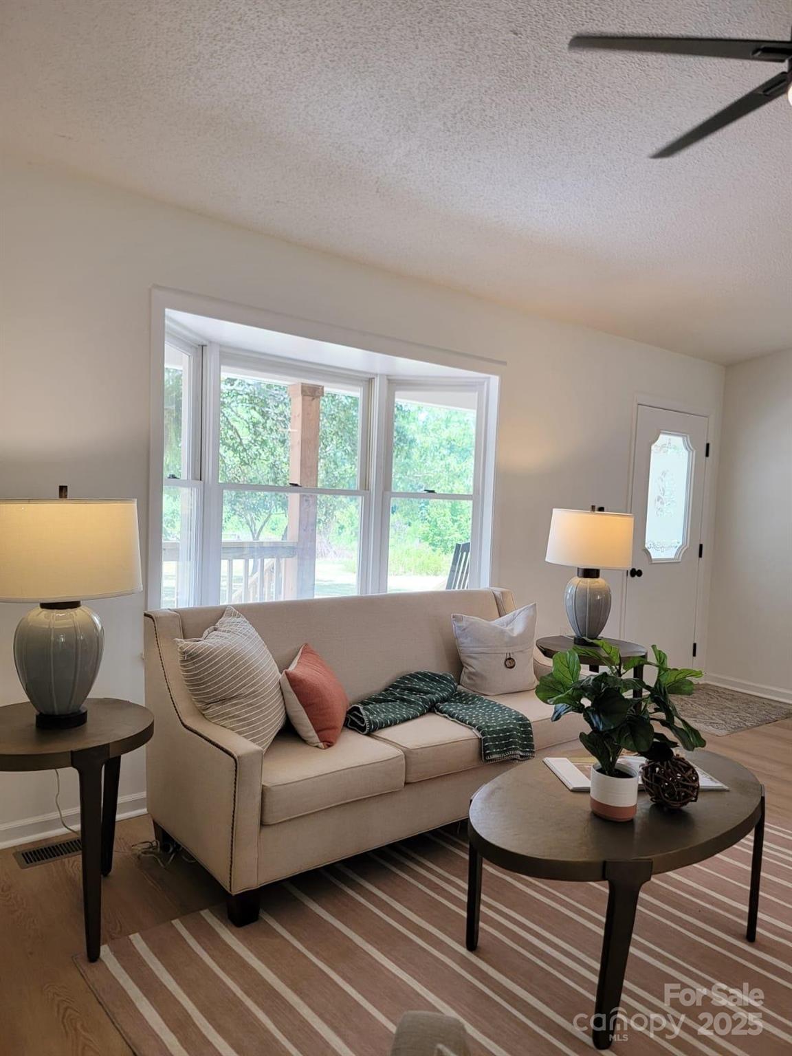 175 Pebble Drive Salisbury, NC 28147 - Photo 11 of 42 a living room with furniture and a large window
