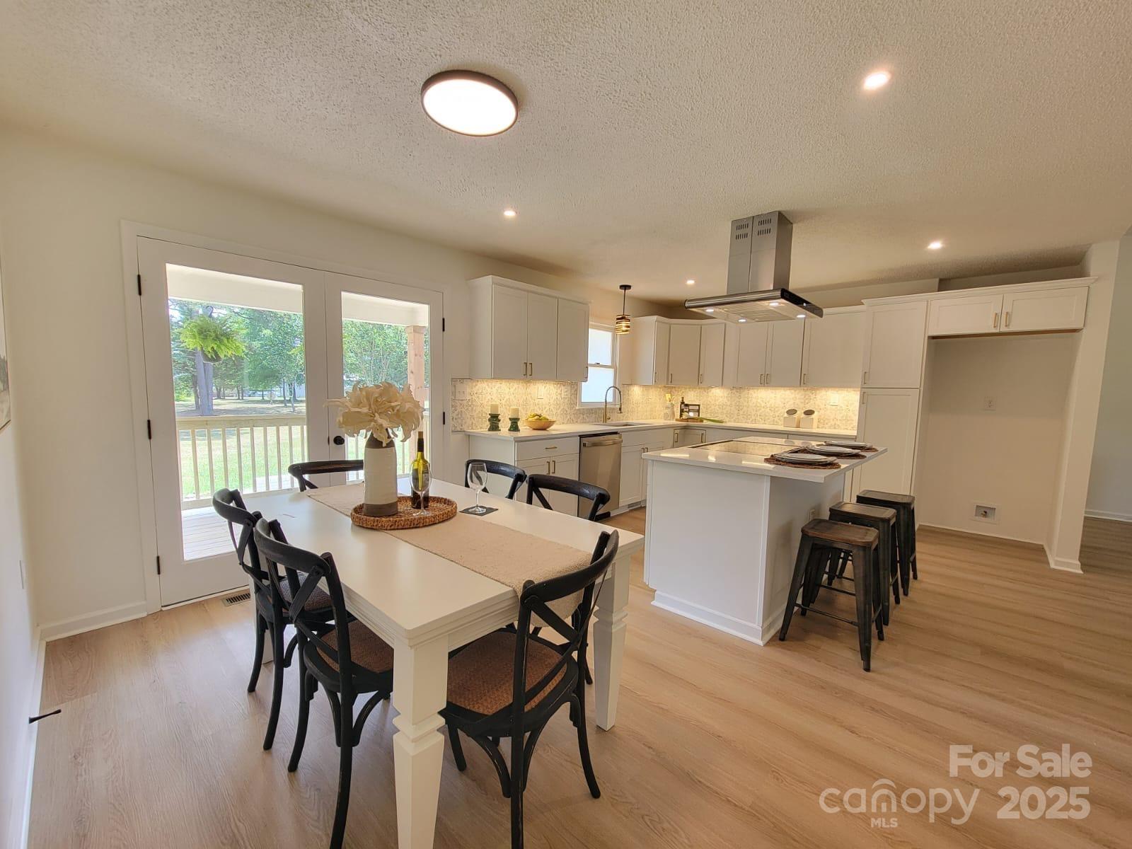 175 Pebble Drive Salisbury, NC 28147 - Photo 14 of 42 a dining room with kitchen island a table and chairs