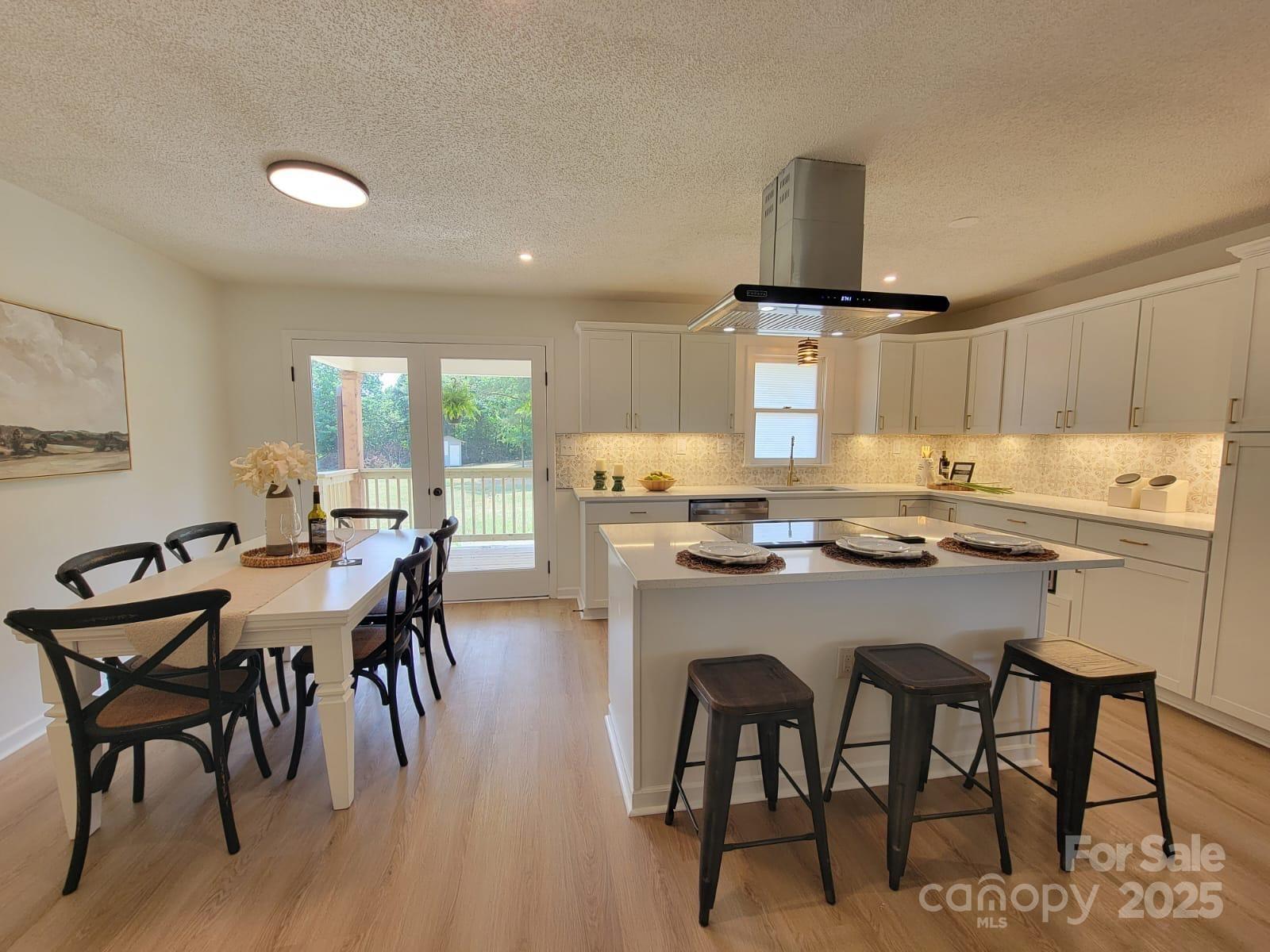175 Pebble Drive Salisbury, NC 28147 - Photo 15 of 42 a kitchen with a table chairs and a refrigerator