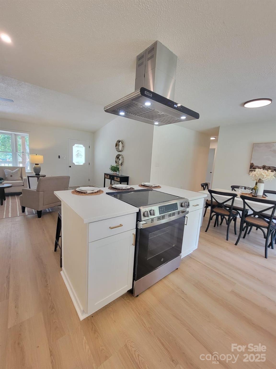 175 Pebble Drive Salisbury, NC 28147 - Photo 18 of 42 a kitchen with a stove and a table chair