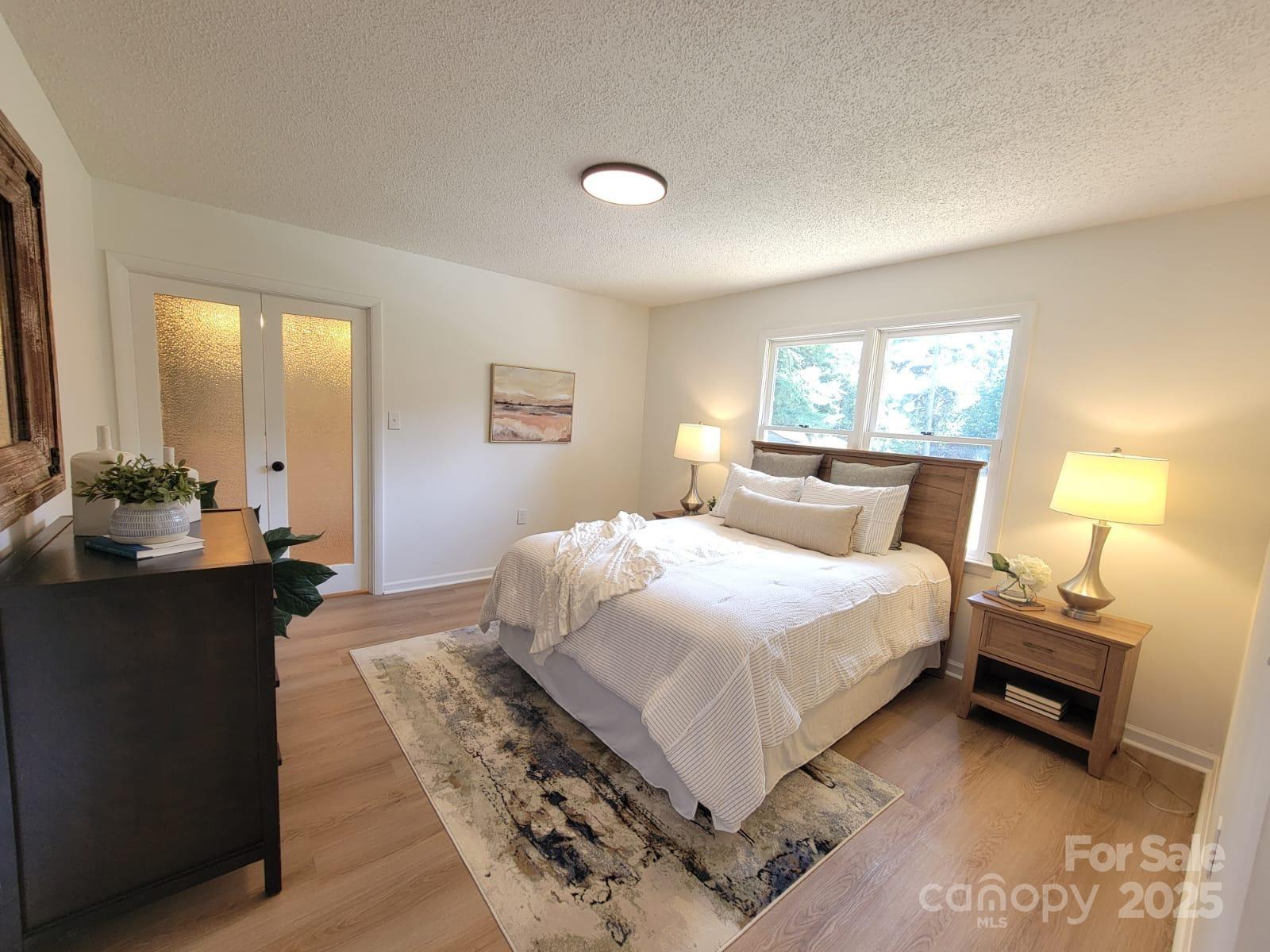 175 Pebble Drive Salisbury, NC 28147 - Photo 22 of 42 a bedroom with a bed and a lamp