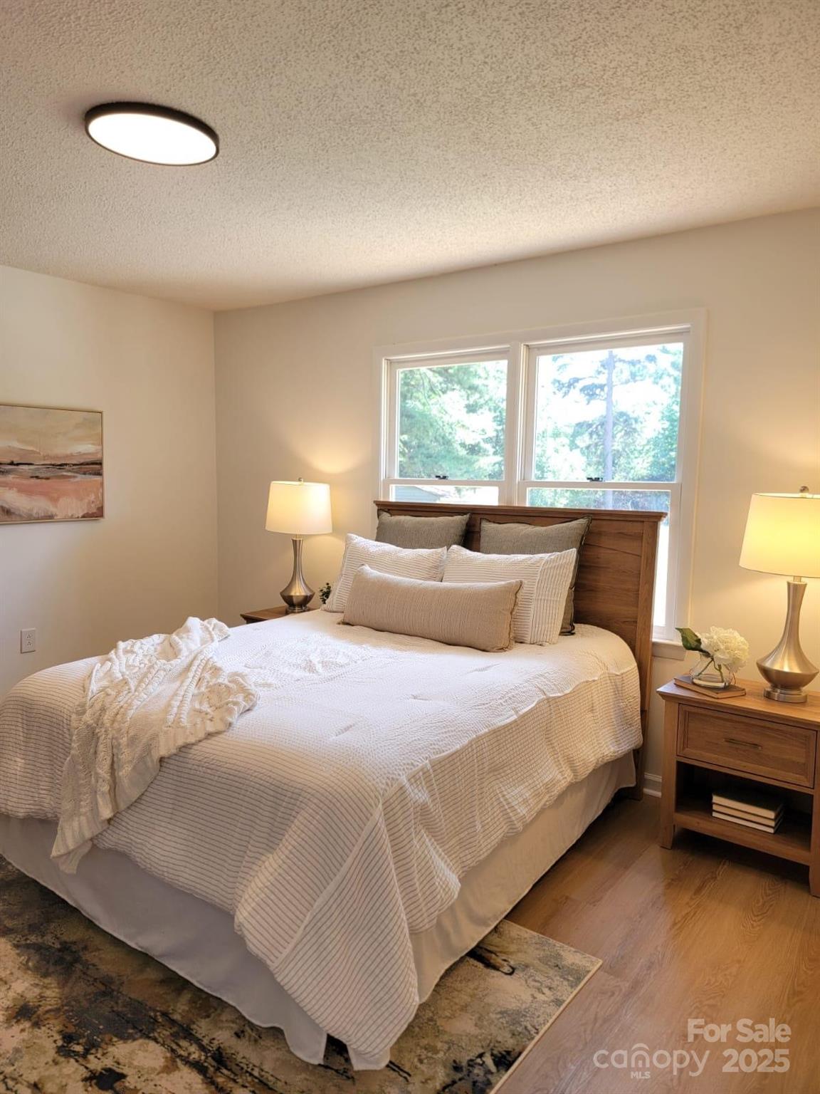 175 Pebble Drive Salisbury, NC 28147 - Photo 25 of 42 a bedroom with a bed and a lamp