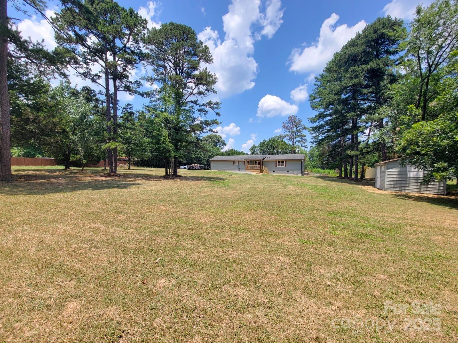 175 Pebble Drive Salisbury, NC 28147 - Photo 37 of 42 a view of outdoor space with garden and trees