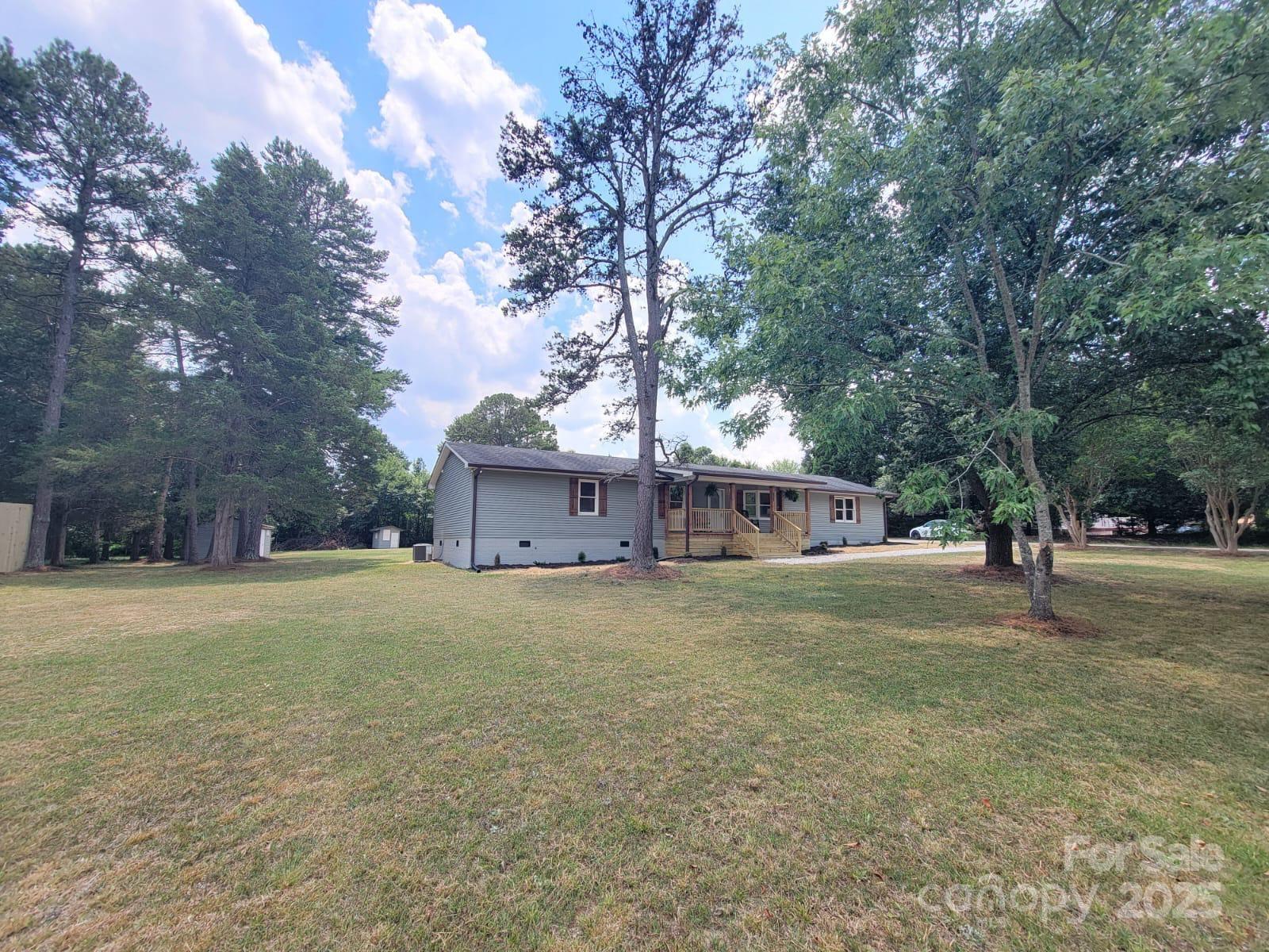 175 Pebble Drive Salisbury, NC 28147 - Photo 38 of 42 a big house with trees in front of it