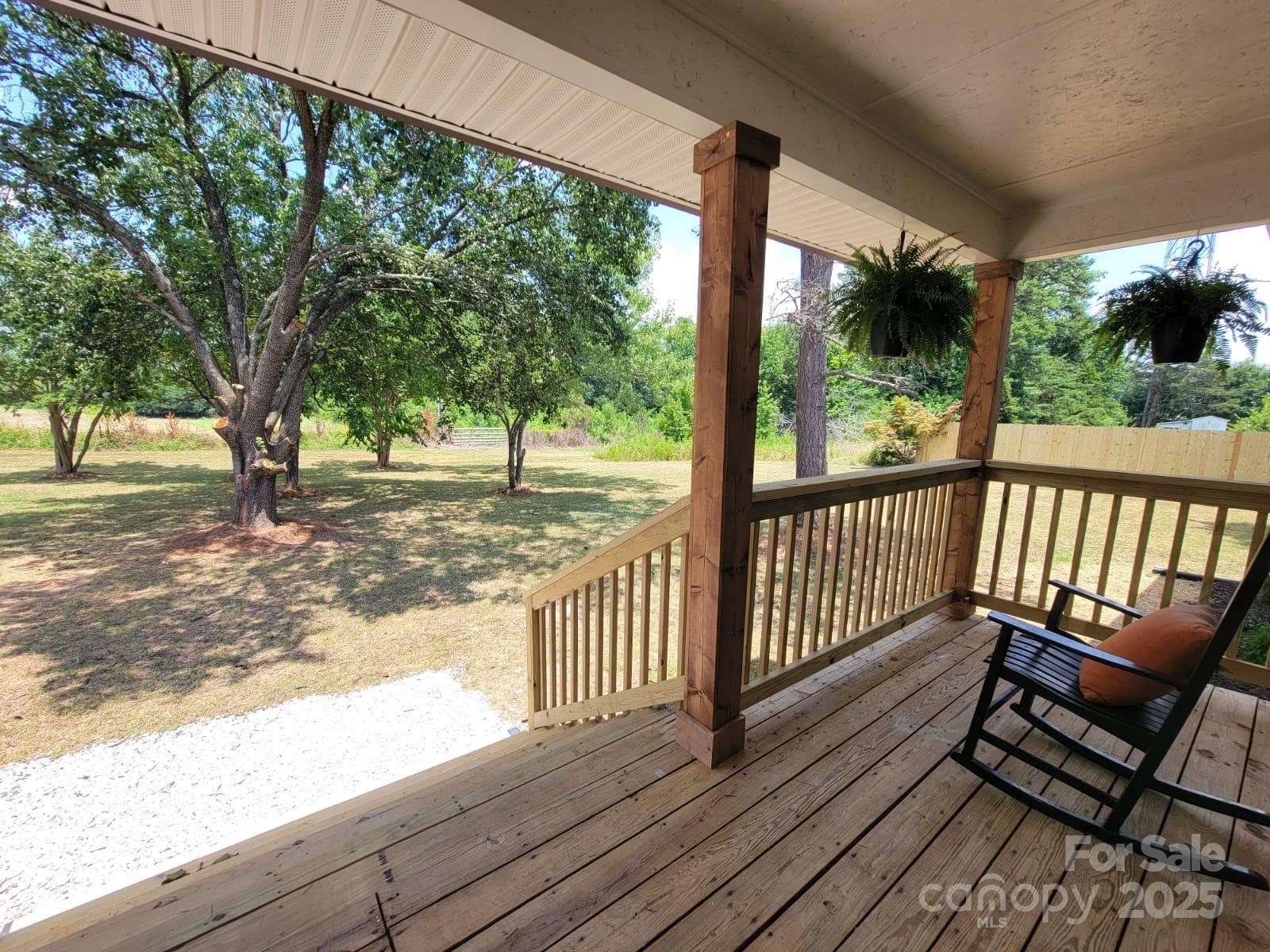 175 Pebble Drive Salisbury, NC 28147 - Photo 8 of 42 a view of a wooden deck with a yard