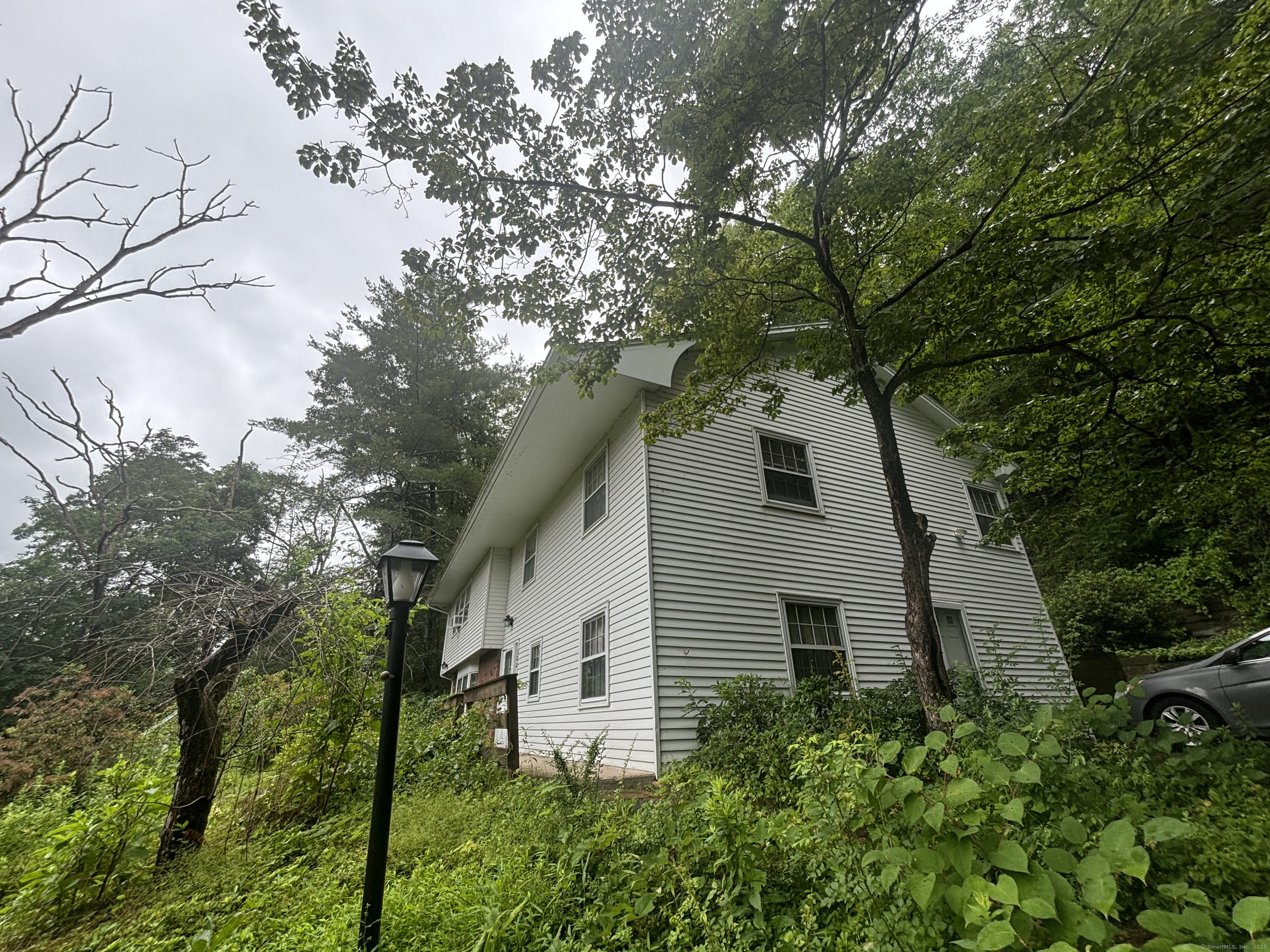 388 Chaffeeville Road Mansfield, CT 06268 - Photo 1 of 13 a house that has tree in front of it