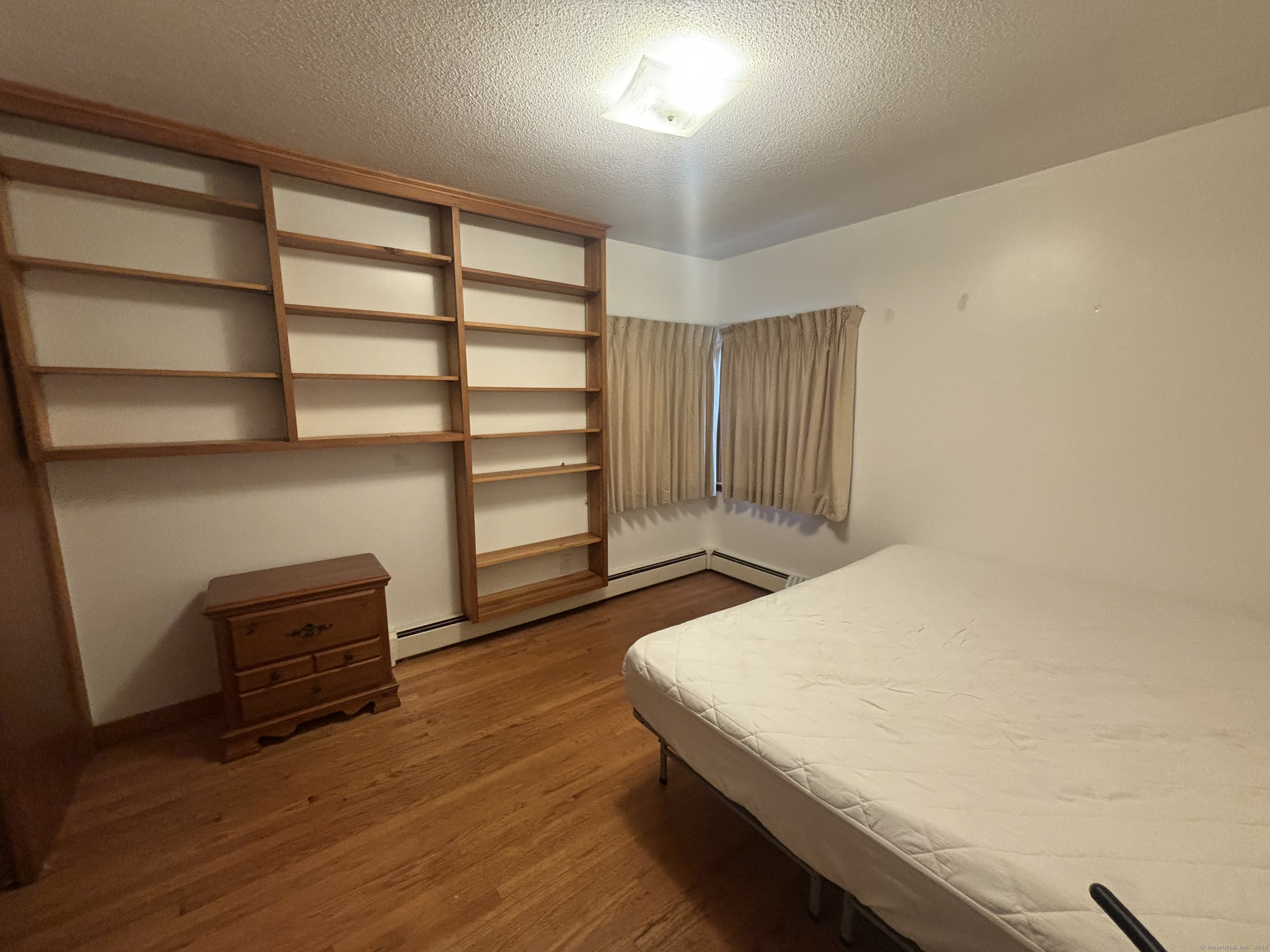 388 Chaffeeville Road Mansfield, CT 06268 - Photo 11 of 13 a room with a bed and a chair