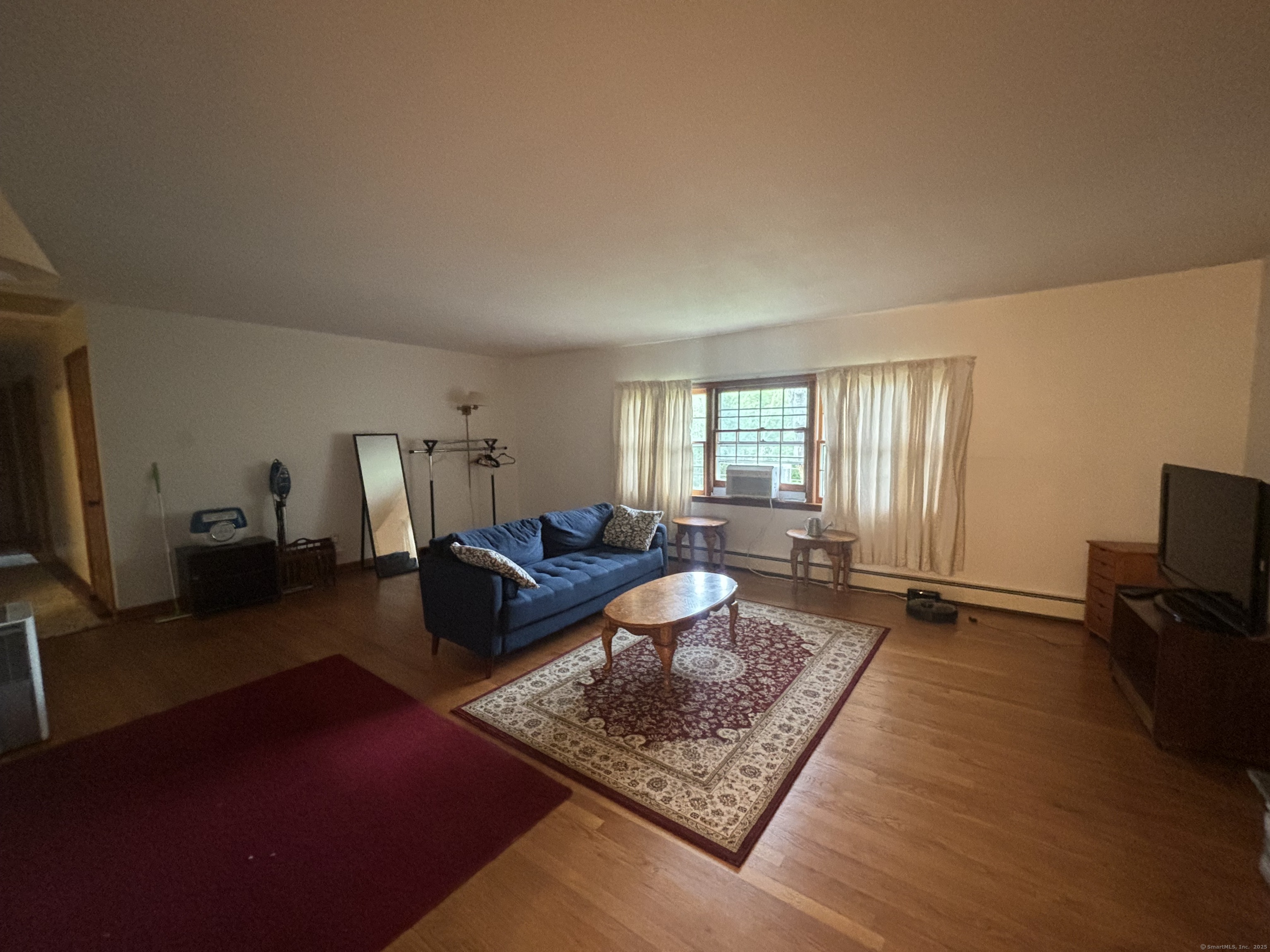388 Chaffeeville Road Mansfield, CT 06268 - Photo 9 of 13 a living room with furniture rug and window