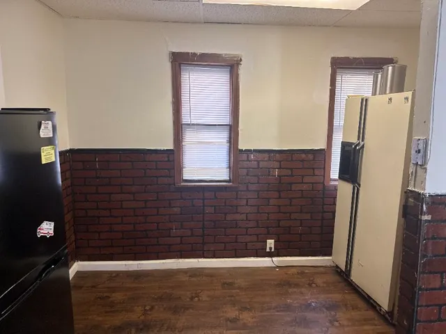 a view of an empty room with windows