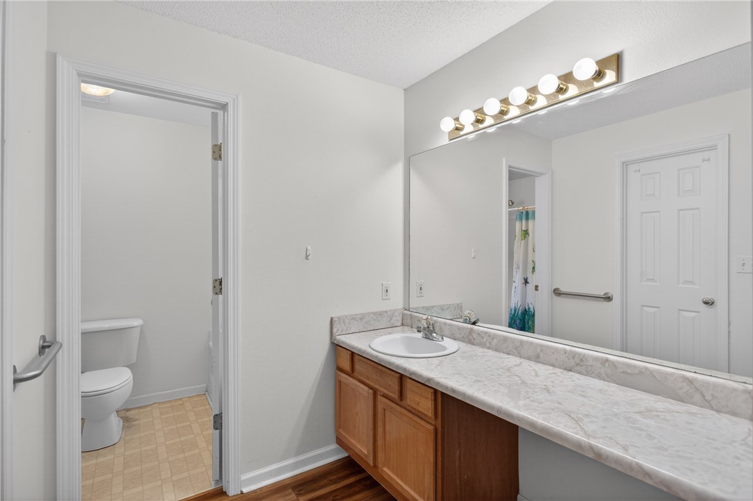 207 Hunters Lane Anderson, SC 29625 - Photo 22 of 46 A well-appointed bathroom vanity with a full-width mirror and efficient lighting.