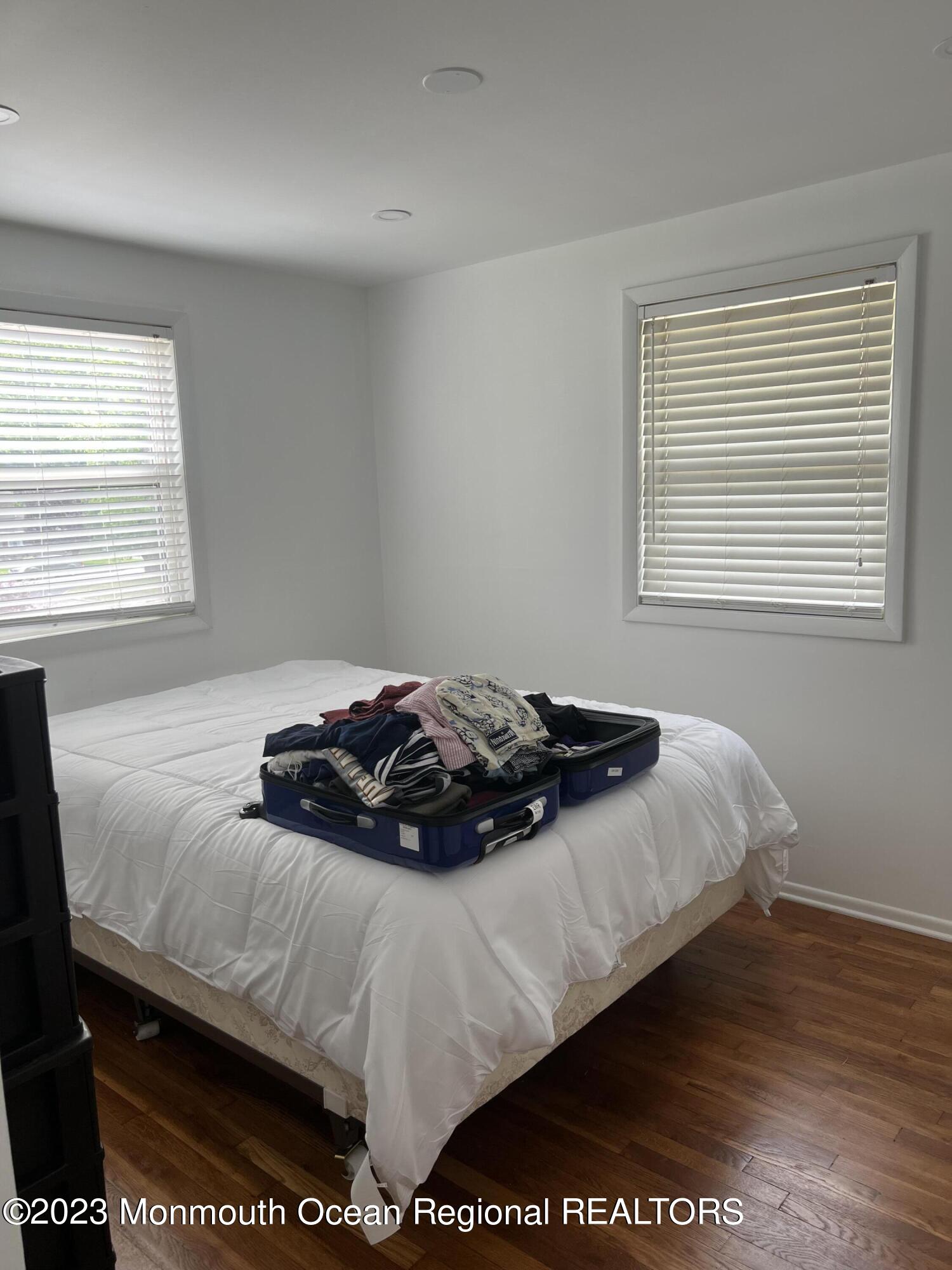 11 Barbara Lane Oakhurst, NJ 07755 - Photo 9 of 10 a bedroom with a bed and a window