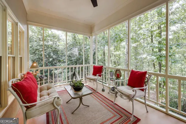 a view of balcony with furniture and umbrella