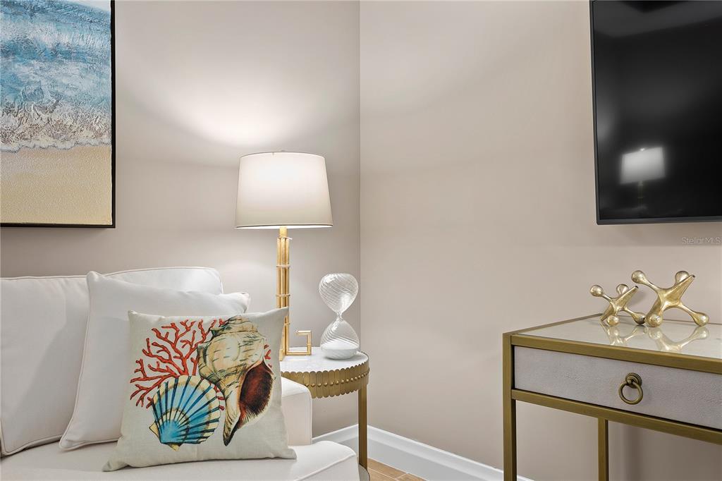 800 Collany Road, Unit 303 St. Petersburg, FL 33715 - Photo 31 of 48 a bedroom with a bed and a lamp