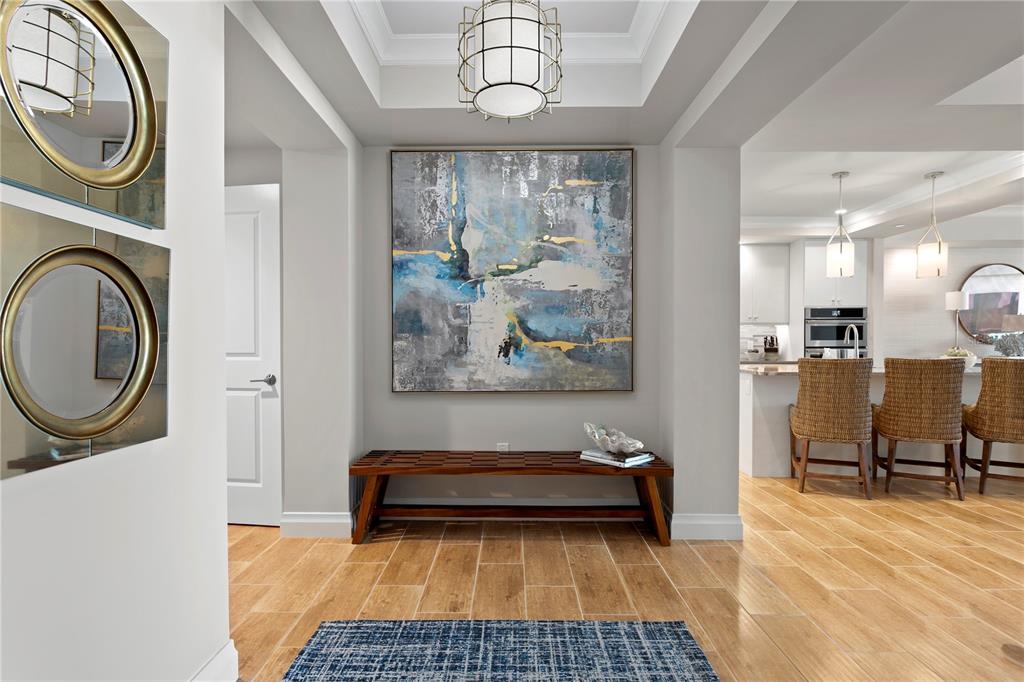 800 Collany Road, Unit 303 St. Petersburg, FL 33715 - Photo 10 of 48 a view of a hallway with washer and dryer