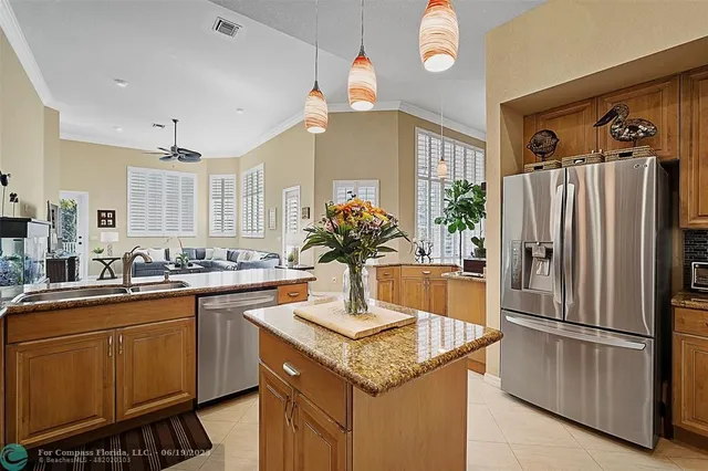 a kitchen with stainless steel appliances granite countertop a sink counter space cabinets and a counter top space