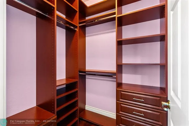 a utility room with sink dryer and washer