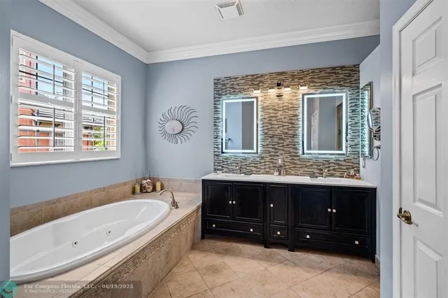 a spacious bedroom with a bed and a tv