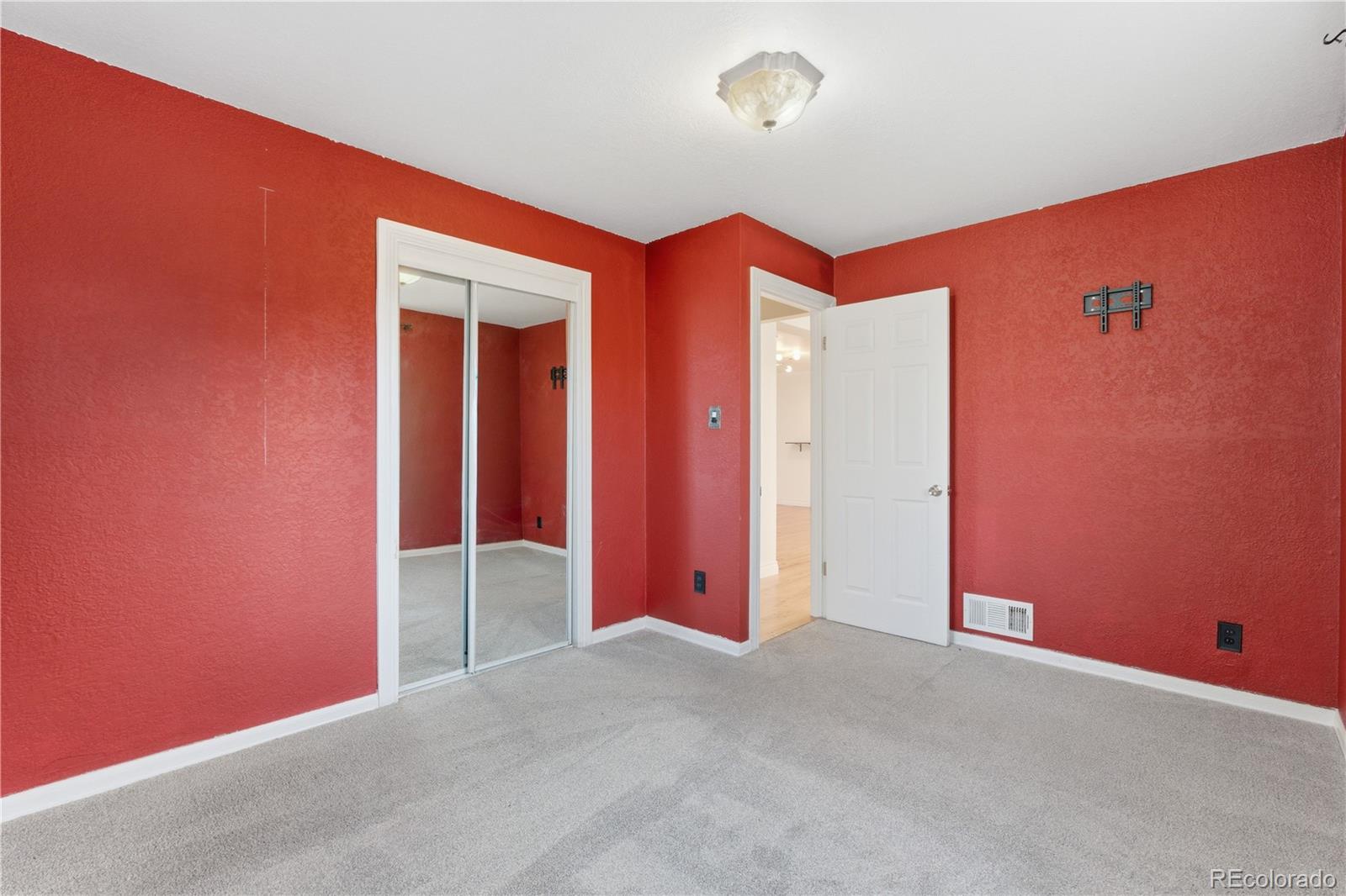 860 Lansing Street Aurora, CO 80010 - Photo 11 of 31 an empty room with windows