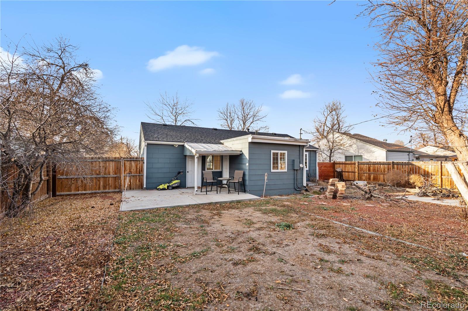 860 Lansing Street Aurora, CO 80010 - Photo 27 of 31 a view of a house with a yard and sitting area