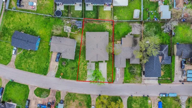 an aerial view of house with a yard