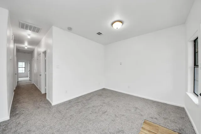 a view of a room with a hallway