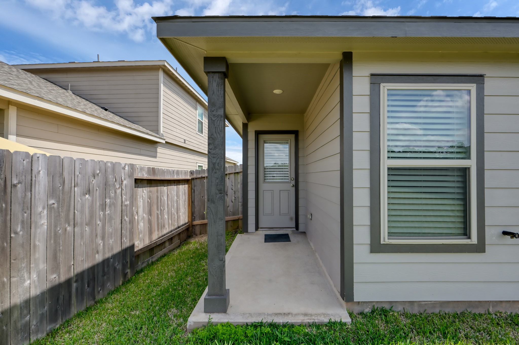 514 Dalloway Street Conroe, TX 77316 - Photo 20 of 27 Back exterior with covered patio and fenced yard