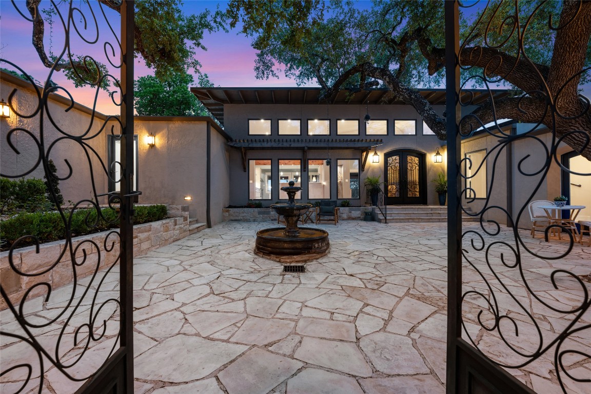 a front view of a house with a bench