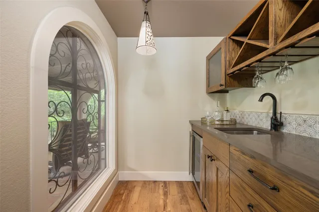 a kitchen with a sink and a window