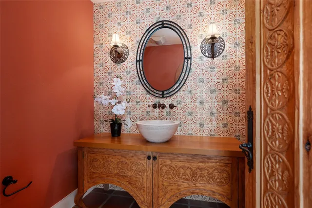 a bathroom with a sink and a mirror
