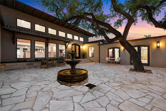 a swimming pool with outdoor seating and yard