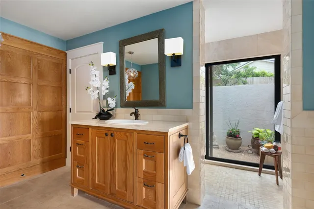 a bathroom with a sink and a mirror