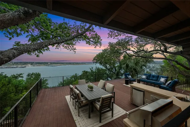 a view of a balcony with furniture