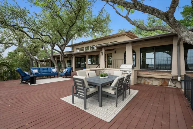 a outdoor space with a table and chairs