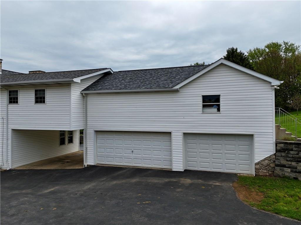 3 Car Garage!  Plus additional covered Parking!!