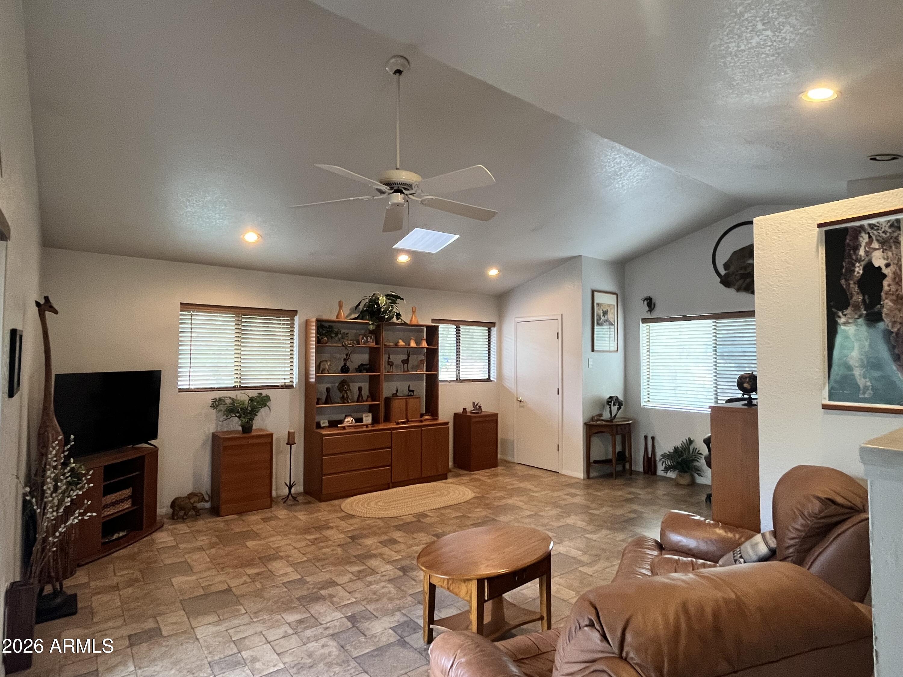 1006 North Matterhorn Road Payson, AZ 85541 - Photo 23 of 37 a living room with furniture and a flat screen tv