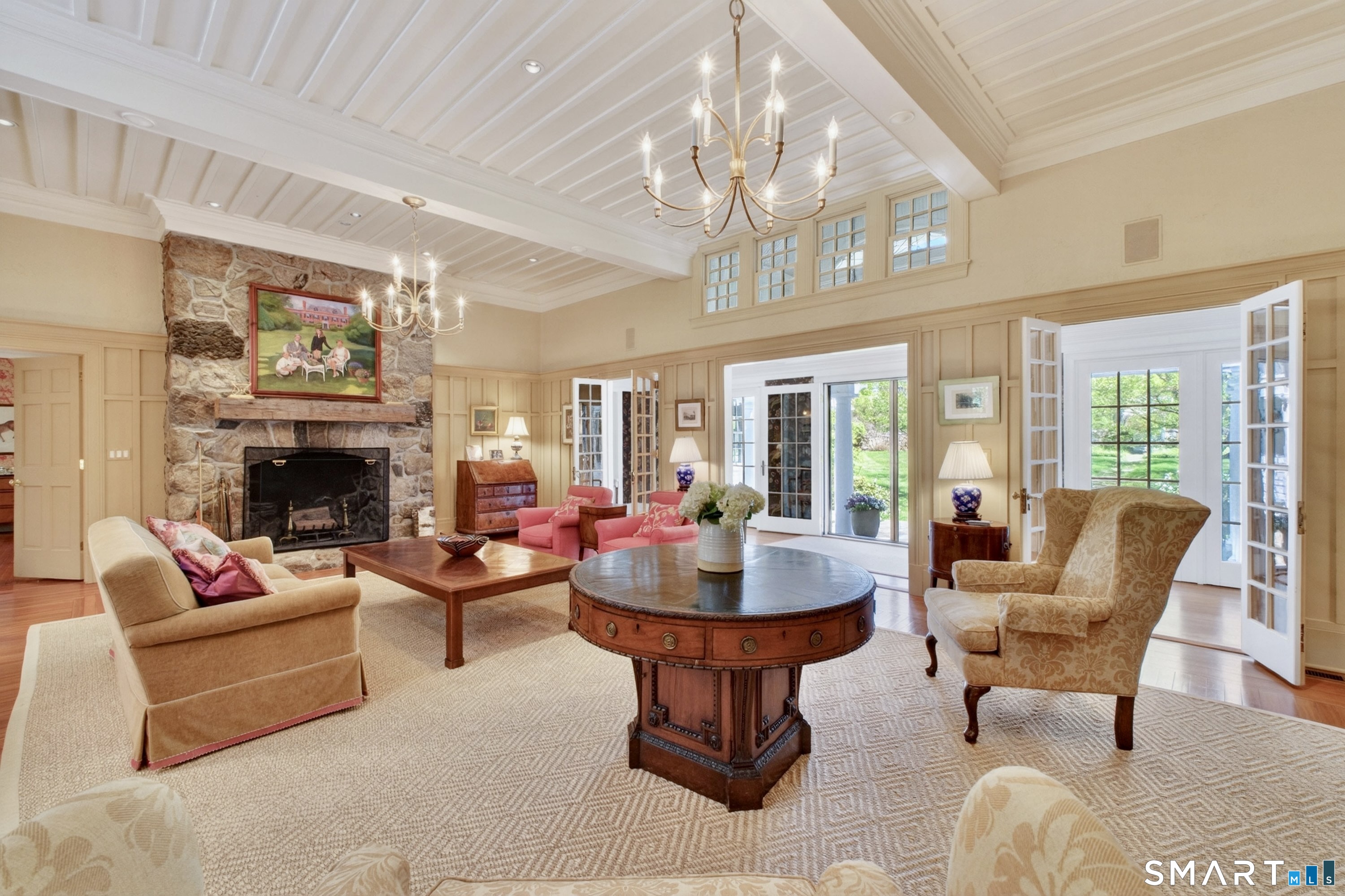 41 Peaceable Street Ridgefield, CT 06877 - Photo 6 of 40 a living room with furniture a chandelier and a fireplace