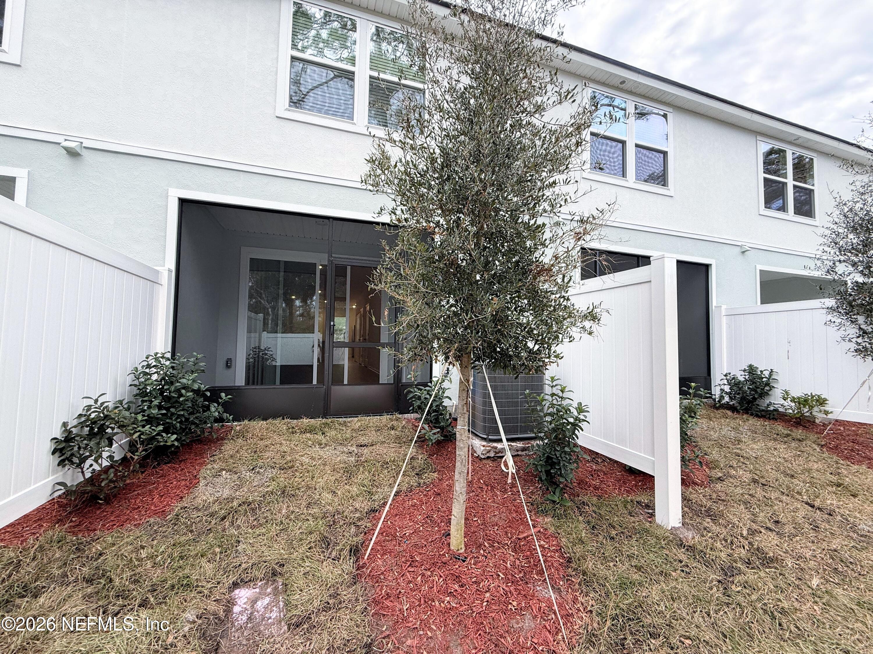 135 Palmetto Rdg Road St. Augustine, FL 32095 - Photo 12 of 19 a view of a house with backyard and trees