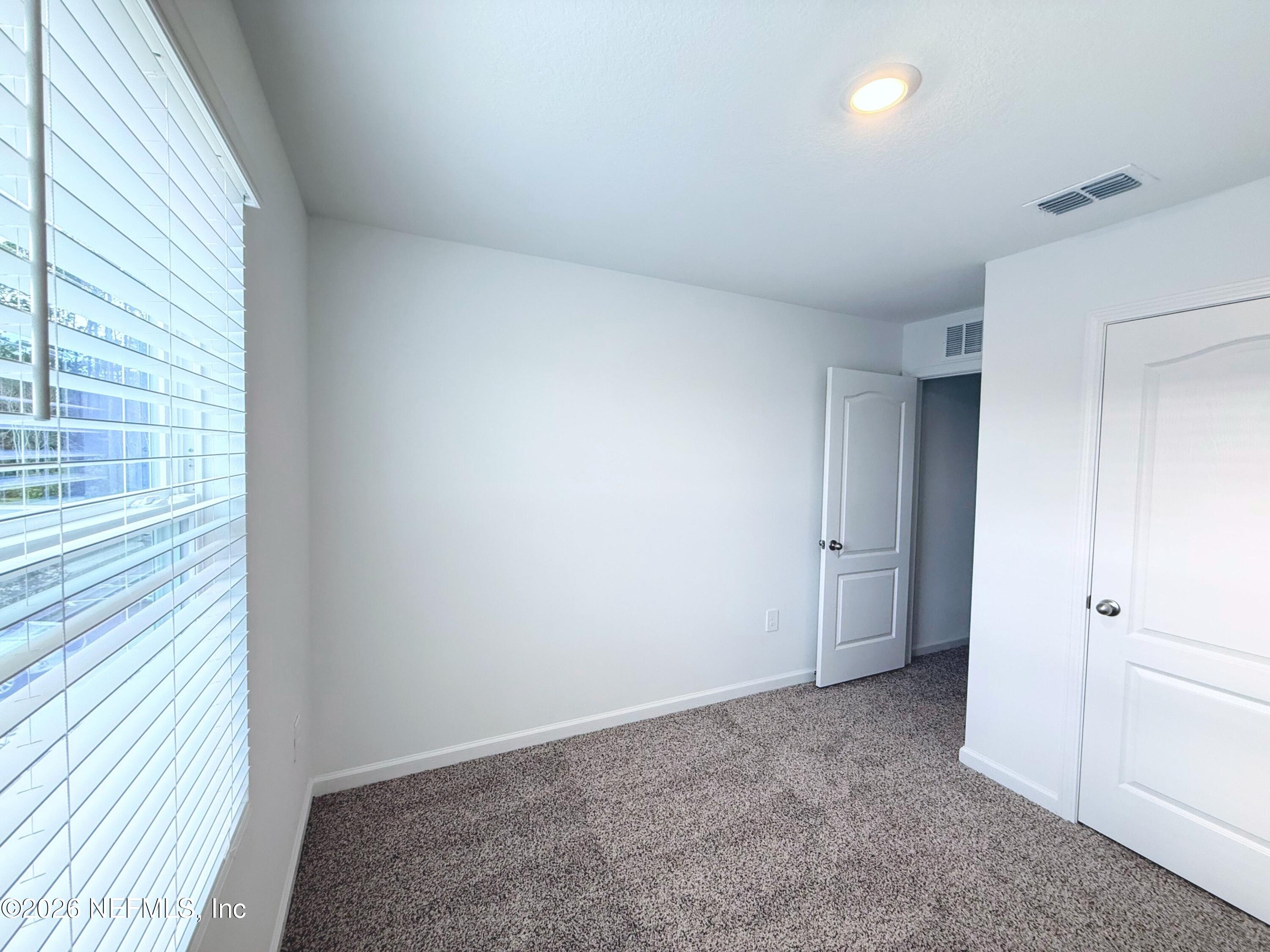 135 Palmetto Rdg Road St. Augustine, FL 32095 - Photo 14 of 19 a view of an empty room and a window