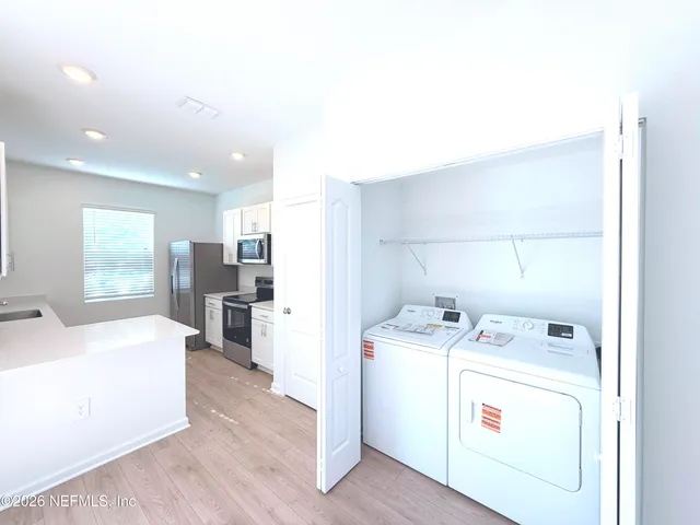 a utility room with dryer and washer