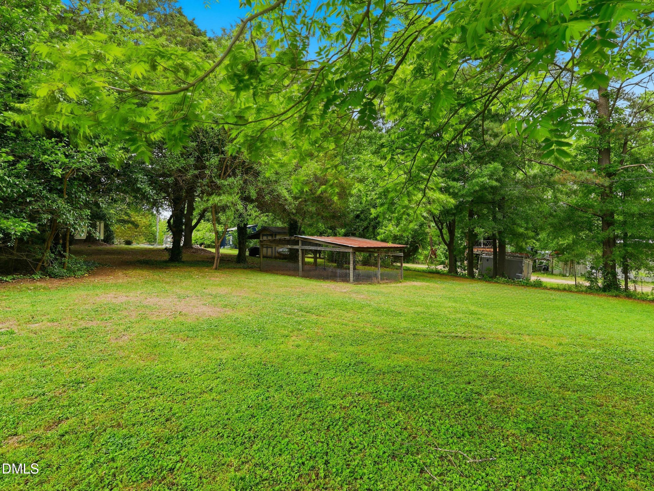 517 Lake Glad Road Wendell, NC 27591 - Photo 28 of 36 a view of outdoor space with deck and yard