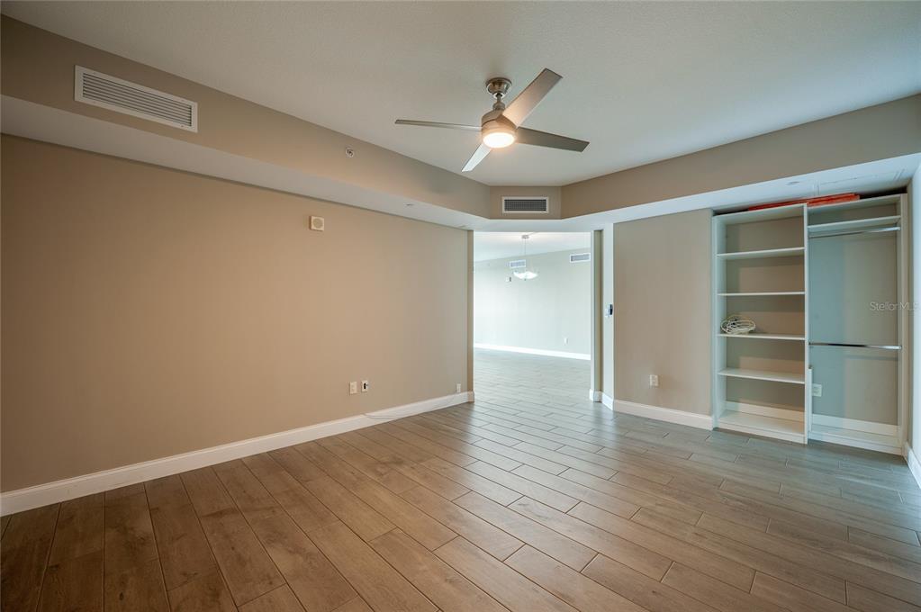 231 Riverside Drive, Unit 1703 Holly Hill, FL 32117 - Photo 14 of 41 wooden floor in an empty room with a window